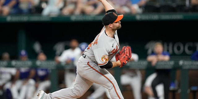 Apr 3, 2023; Arlington, Texas, USA; Baltimore Orioles relief pitcher Danny Coulombe (54) delivers a pitch to the Texas Rangers during the second inning at Globe Life Field.