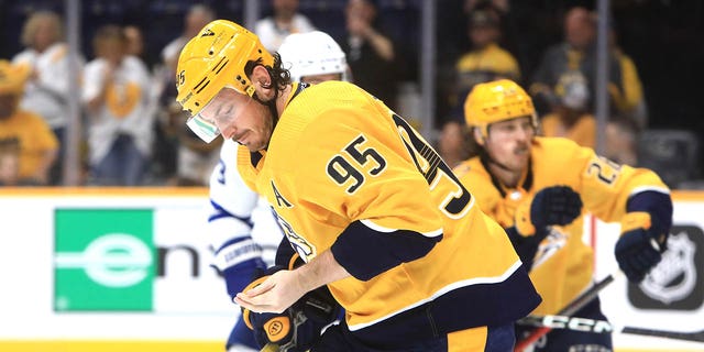 Nashville Predators center Matt Duchene (95) skates to the bench after sustaining a hand injury during the NHL game between the Nashville Predators and Toronto Maple Leafs, held on March 26, 2023, at Bridgestone Arena in Nashville, Tennessee.