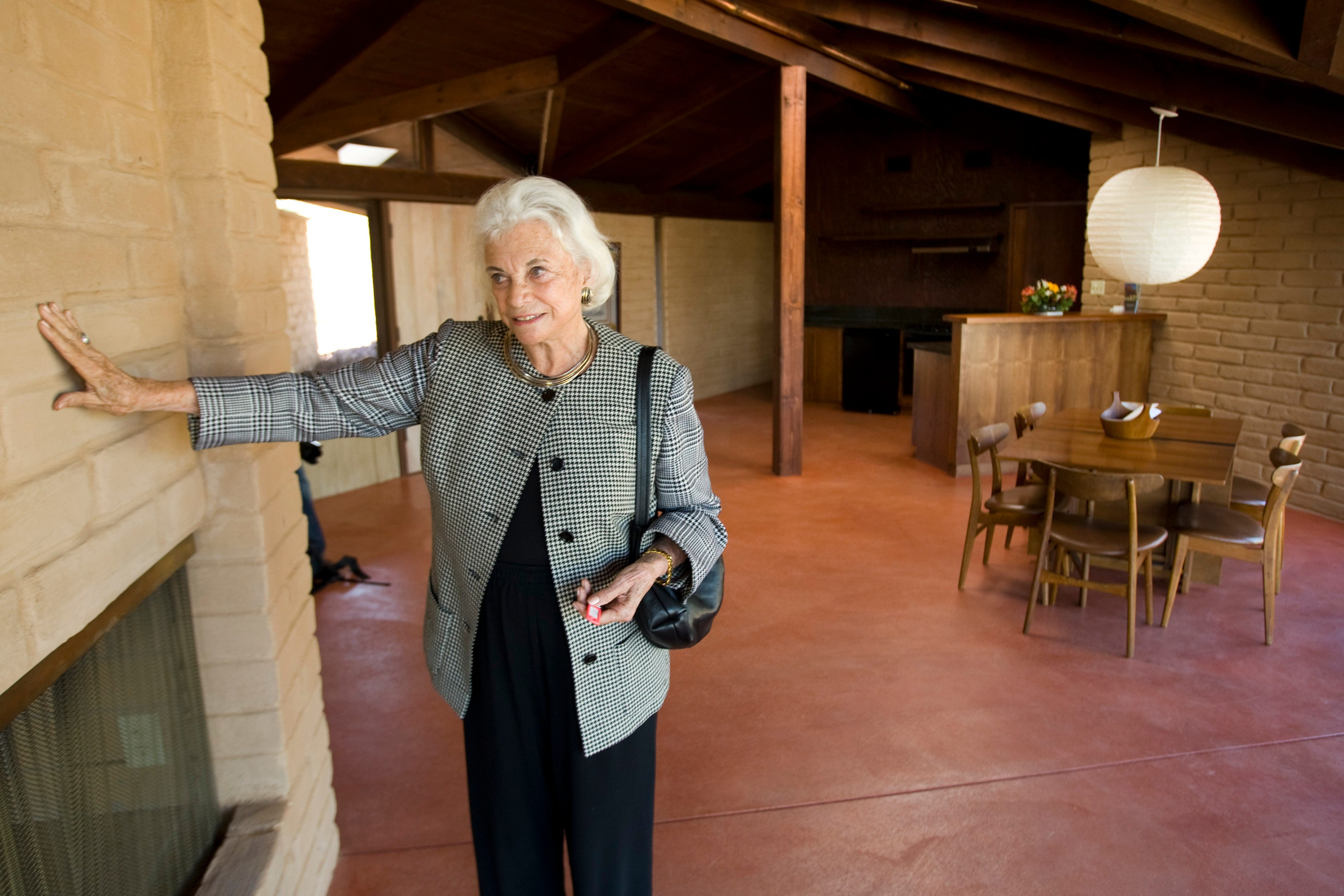 Retired Supreme Court Justice Sandra Day O'Connor in 2010 shows her 1958 adobe home, which was moved and restored at the Arizona Historical Society Museum in Tempe.