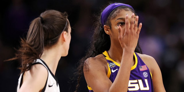 Angel Reese #10 of the LSU Lady Tigers reacts towards Caitlin Clark #22 of the Iowa Hawkeyes during the fourth quarter during the 2023 NCAA Women's Basketball Tournament championship game at American Airlines Center on April 02, 2023 in Dallas.