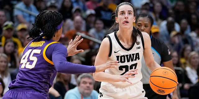 Iowa's Caitlin Clark looks to shoot past LSU's Alexis Morris during the NCAA Women's Final Four championship game, Sunday, April 2, 2023, in Dallas.