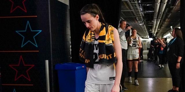 Iowa's Caitlin Clark walks to the locker room after the NCAA championship game against LSU, Sunday, April 2, 2023, in Dallas.