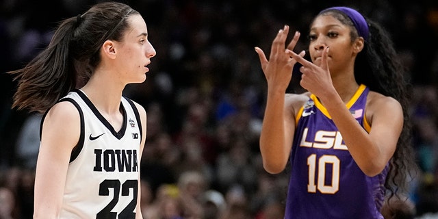 LSU's Angel Reese reacts in front of Iowa's Caitlin Clark during the NCAA Women's Final Four championshipl game Sunday, April 2, 2023, in Dallas.