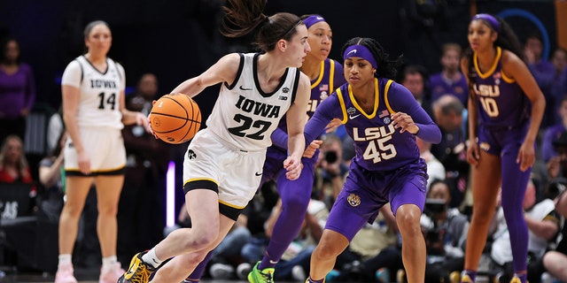 Iowa's Caitlin Clark dribbles against Alexis Morris of LSU at American Airlines Center on April 2, 2023 in Dallas.