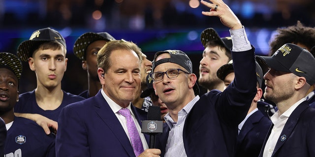 Head coach Dan Hurley of the Connecticut Huskies talks with Jim Nantz after winning the NCAA Men's Basketball Tournament National Championship game on April 3, 2023, in Houston.