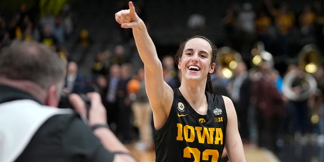 Iowa's Caitlin Clark celebrates after an NCAA Final Four semifinals game against South Carolina Friday, March 31, 2023, in Dallas.