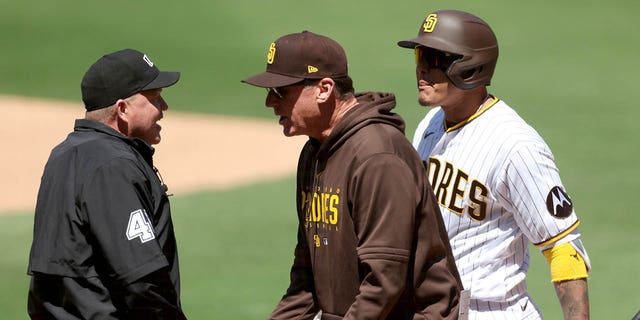 Manager Bob Melvin, center, argues with umpire Ron Kulpa after Manny Machado of the San Diego Padres was called out on a timed third strike during the first inning of a game against the Arizona Diamondbacks at PETCO Park April 4, 2023, in San Diego. 