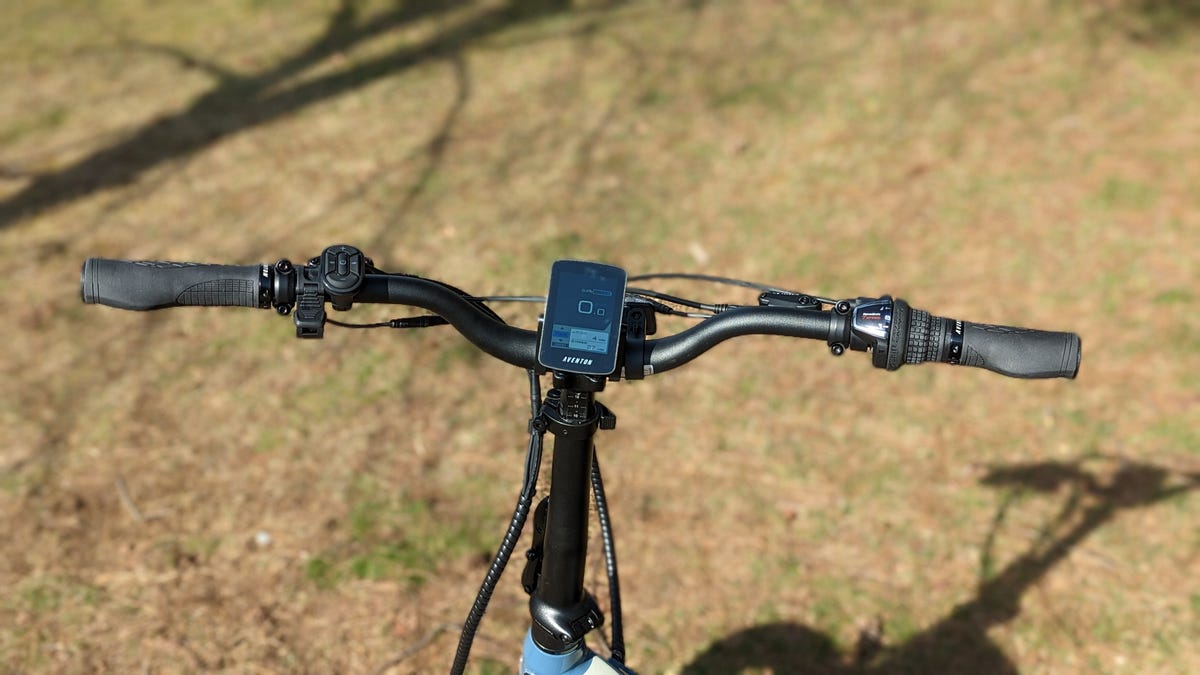 Aventon Abound cargo e-bike handlebars over grass.