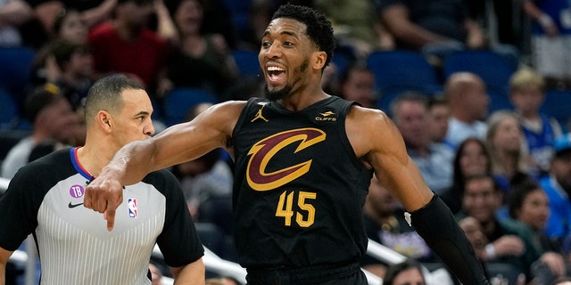 Cleveland Cavaliers' Donovan Mitchell celebrates after making a 3-point shot against the Magic, Tuesday, April 4, 2023, in Orlando, Florida.