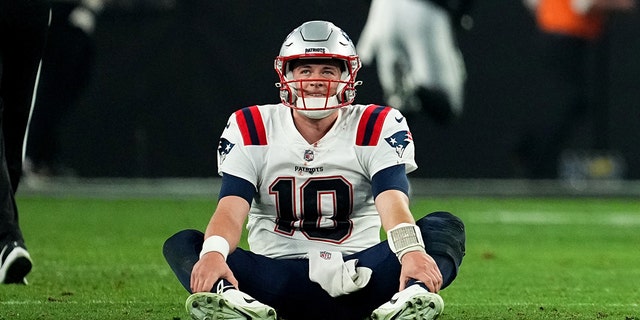 Mac Jones, #10 of the New England Patriots, looks on after losing to the Las Vegas Raiders at Allegiant Stadium on Dec. 18, 2022 in Las Vegas.