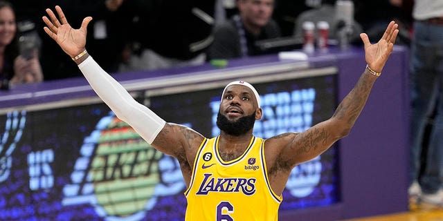 Los Angeles Lakers forward LeBron James celebrates after scoring to pass Kareem Abdul-Jabbar to become the NBA's all-time leading scorer during the second half of an NBA basketball game against the Oklahoma City Thunder Tuesday, Feb. 7, 2023, in Los Angeles.