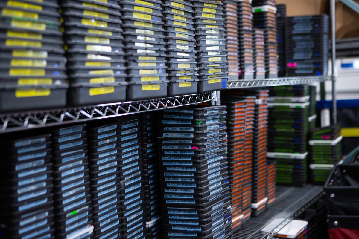 The color-coded trays used in the receiving area of Samsung's repair facility