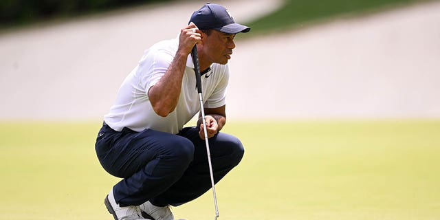 Tiger Woods lines up a putt on the 13th green during the Masters Tournament on April 6, 2023.