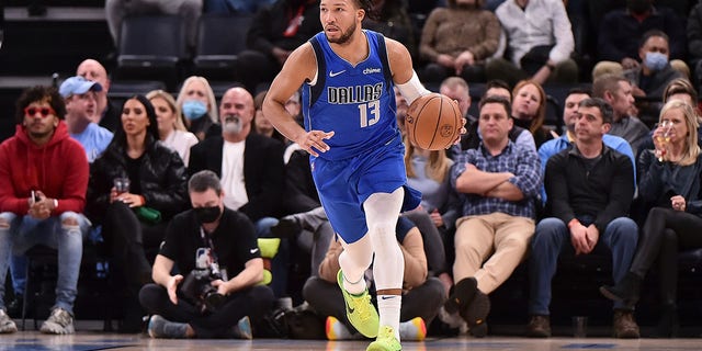 Jalen Brunson #13 of the Dallas Mavericks brings the ball up court during the game against the Memphis Grizzlies at FedExForum on January 14, 2022 in Memphis, Tennessee.