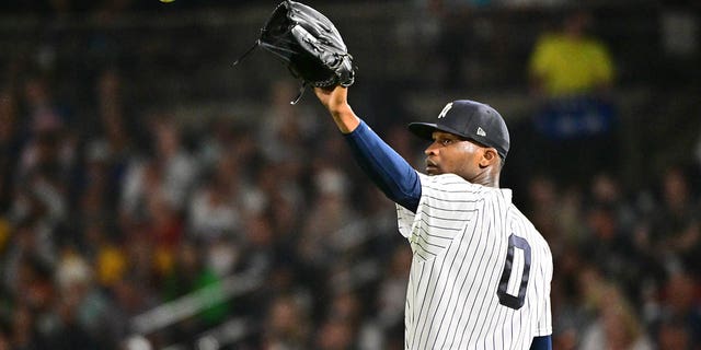 Domingo German, #0 of the New York Yankees, looks to receive the ball back in the second inning against the Pittsburgh Pirates during a Grapefruit League Spring Training game at George M. Steinbrenner Field on March 6, 2023 in Tampa, Florida.