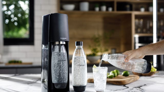 SodaStream Terra soda water maker with bottles and water glass