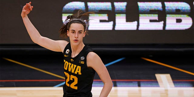 Caitlin Clark, #22 of the Iowa Hawkeyes, reacts after a three-point basket during the fourth quarter against the South Carolina Gamecocks during the 2023 NCAA Women's Basketball Tournament Final Four semifinal game at American Airlines Center on March 31, 2023, in Dallas, Texas. 