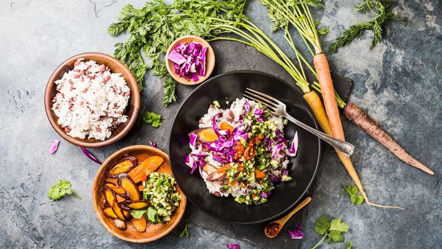 A meal from Purple Carrot is displayed on a counter top.