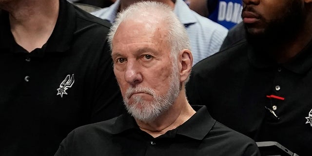 San Antonio Spurs beach coach Gregg Popovich sits on the bench during the first quarter of an NBA basketball game against the Dallas Mavericks in Dallas, Sunday, April 9, 2023.