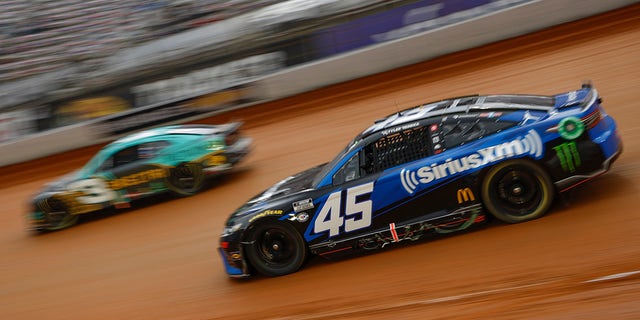 Tyler Reddick, driver of the #45 SiriusXM Radio Toyota, and Austin Dillon, driver of the #3 BREZTRI Chevrolet, race during qualifying heat # for the NASCAR Cup Series Food City Dirt Race on Dirt at Bristol Motor Speedway on April 08, 2023 in Bristol, Tennessee. 