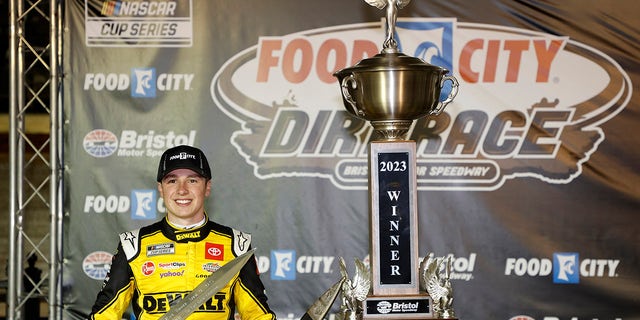 Christopher Bell, driver of the #20 DeWalt Power Stack Toyota, celebrates in victory lane after winning the NASCAR Cup Series Food City Dirt Race at Bristol Motor Speedway on April 09, 2023 in Bristol, Tennessee.