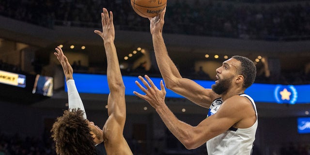 Minnesota Timberwolves center Rudy Gobert shoots over San Antonio Spurs forward Dominick Barlow, Saturday, April 8, 2023, in Austin, Texas.