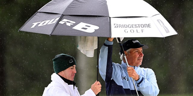 Fred Couples talks with his caddie on the 17th hole during the third round of the Masters on April 8, 2023.