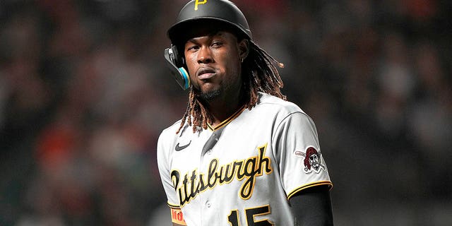 Oneil Cruz #15 of the Pittsburgh Pirates reacts as he walks back to the dugout after striking out against the San Francisco Giants in the top of the ninth inning at Oracle Park on August 13, 2022 in San Francisco, California.