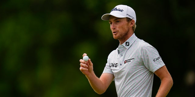 Will Zalatoris waves after making a putt on the eighth hole during the final round of the PGA Championship golf tournament at Southern Hills Country Club, Sunday, May 22, 2022, in Tulsa, Okla.