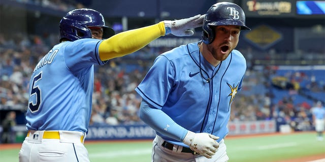 Brandon Lowe of the Tampa Bay Rays celebrates his home run against the Boston Red Sox at Tropicana Field on April 10, 2023, in St. Petersburg.