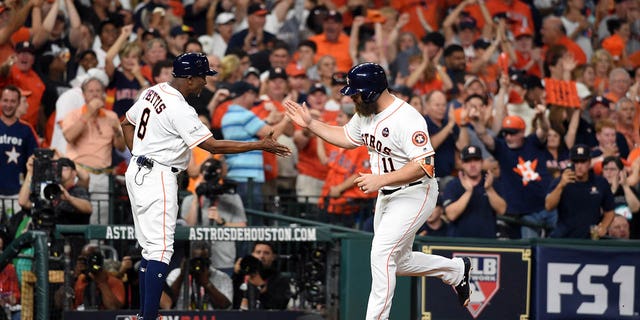 Evan Gattis #11 of the Houston Astros rounds the bases after hitting a solo home run in the fourth inning of Game 7 of the American League Championship Series against the New York Yankees at Minute Maid Park on Saturday, October 21, 2017 in Houston, Texas. 