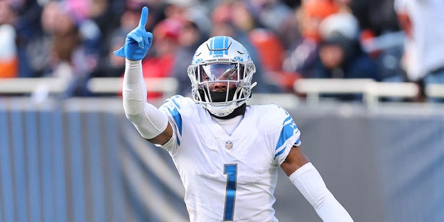 Jeff Okudah of the Detroit Lions celebrates an interception against the Chicago Bears at Soldier Field Nov. 13, 2022, in Chicago. 