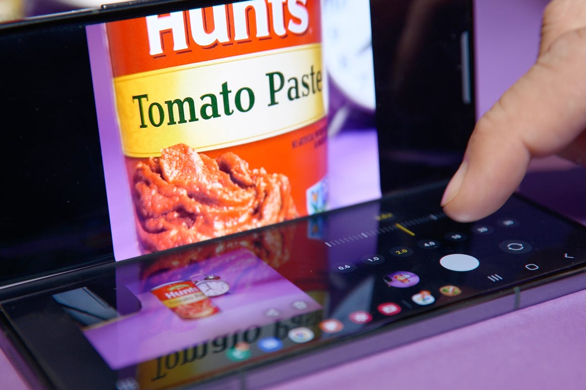 Taking a photo of a can of tomato paste