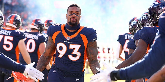 DreMont Jones #93 of the Denver Broncos takes the field against the Kansas City Chiefs at Empower Field At Mile High on December 11, 2022 in Denver, Colorado. 