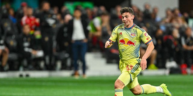 New York forward Dante Vanzeir (13) dribbles the ball during the MLS match between the New York Red Bulls and Atlanta United FC on April 1st, 2023 at Mercedes-Benz Stadium in Atlanta, GA.