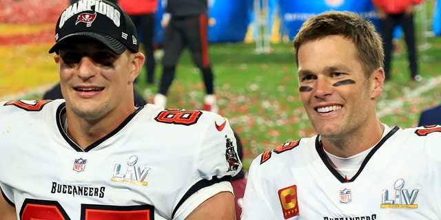 Rob Gronkowski #87 and Tom Brady #12 of the Tampa Bay Buccaneers celebrate after defeating the Kansas City Chiefs in Super Bowl LV at Raymond James Stadium on February 07, 2021 in Tampa, Florida.