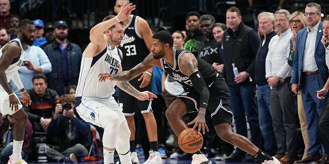 Paul George #13 of the LA Clippers drives to the basket during the game against the Dallas Mavericks on November 15, 2022, at the American Airlines Center in Dallas, Texas.