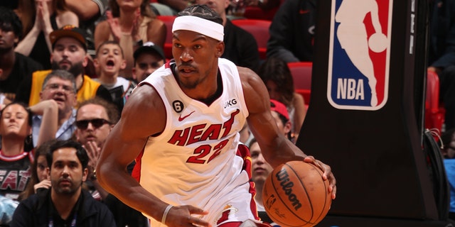 Jimmy Butler #22 of the Miami Heat dribbles the ball during the 2023 Play-In Tournament against the Atlanta Hawks on April 11, 2023, at Kaseya Center in Miami, Florida. 