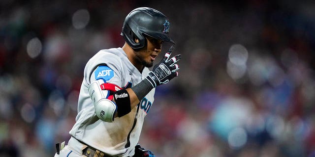 Miami Marlins' Luis Arraez runs to first for a single with one run batted in off of Phillies' Andrew Bellatti, Tuesday, April 11, 2023, in Philadelphia.