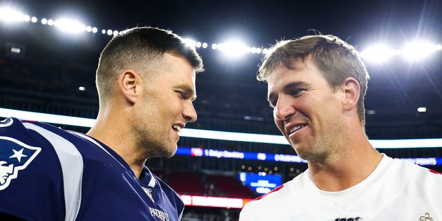 Tom Brady of the New England Patriots greets Eli Manning of the New York Giants after a preseason game at Gillette Stadium on Aug. 29, 2019, in Foxborough, Massachusetts.