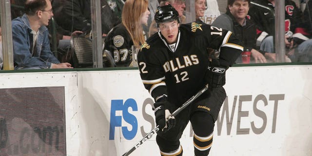 Raymond Sawada #12 of the Dallas Stars handles the puck against the Pittsburgh Penguins on March 1, 2009 at the American Airlines Center in Dallas, Texas.