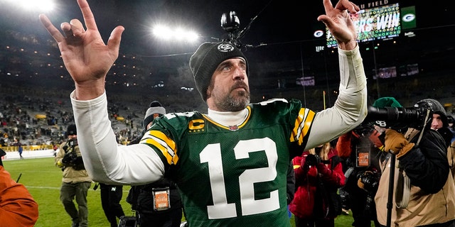 Green Bay Packers quarterback Aaron Rodgers waves to fans as he leaves the field after a game against the Los Angeles Rams in Green Bay, Wis. Dec. 19, 2022. 