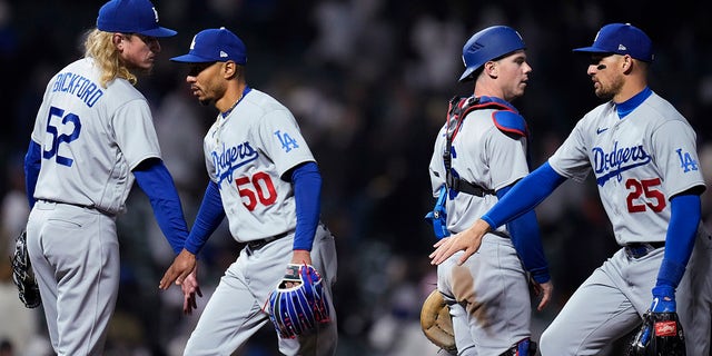 Los Angeles Dodgers celebrate after their 10-5 victory over the Giants in San Francisco, Wednesday, April 12, 2023.