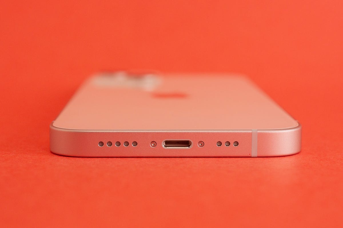 The iPhone 13, looking at its Lightning charging port