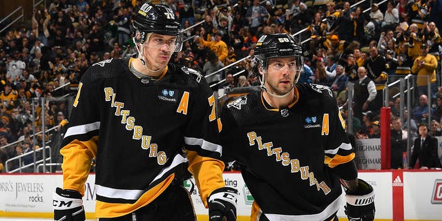 Evgeni Malkin and Kris Letang of the Penguins during the game against the Edmonton Oilers at PPG Paints Arena on Feb. 23, 2023, in Pittsburgh.