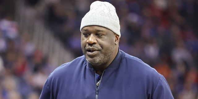 Shaquille ONeal attends the Big 12 basketball tournament championship game between the Texas Longhorns and Kansas Jayhawks on March 11, 2023, at T-Mobile Center in Kansas City, MO.