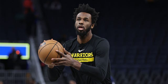 Andrew Wiggins of the Golden State Warriors warms up before a game against the Washington Wizards at Chase Center Feb. 13, 2023, in San Francisco. 