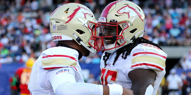 Birmingham Stallions quarterback J'Mar Smith (6) and Birmingham Stallions running back Bo Scarbrough (25) celebrates after Scarbrough scored on a 36-yard run during the first quarter of the USFL Championship Game between the Birmingham Stallions and Philadelphia Stars on July 3, 2022, at the Tom Benson Hall of Fame Stadium in Canton, OH.