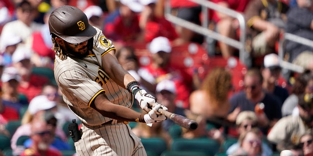 San Diego Padres' Fernando Tatis Jr. hits an RBI single during the third inning of a baseball game against the St. Louis Cardinals Sunday, Sept. 19, 2021, in St. Louis. (AP Photo/Jeff Roberson)