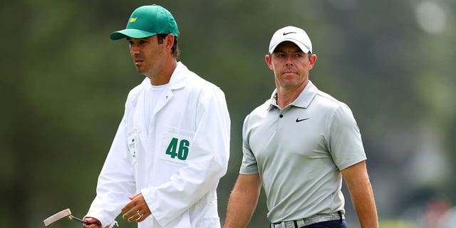 Rory McIlroy of Northern Ireland and caddie Harry Diamond react on the eighth green during the second round of the 2023 Masters Tournament at Augusta National Golf Club April 7, 2023, in Augusta, Ga. 